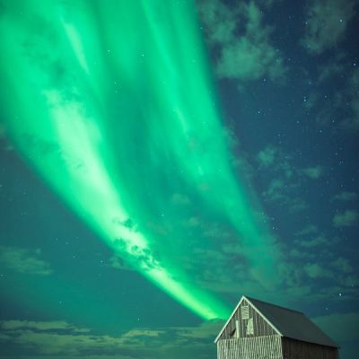 Aurora in Reykjavik, Iceland by Adam Skrzeszewski